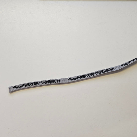 Flachkordel 1m "perfekt unperfekt" grau